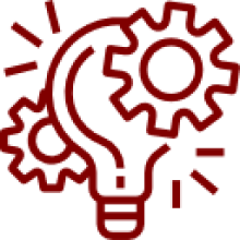 Red lightbulb and gears on black background.